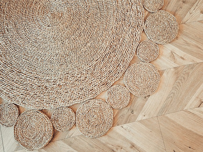 circular jute rug on wood floor